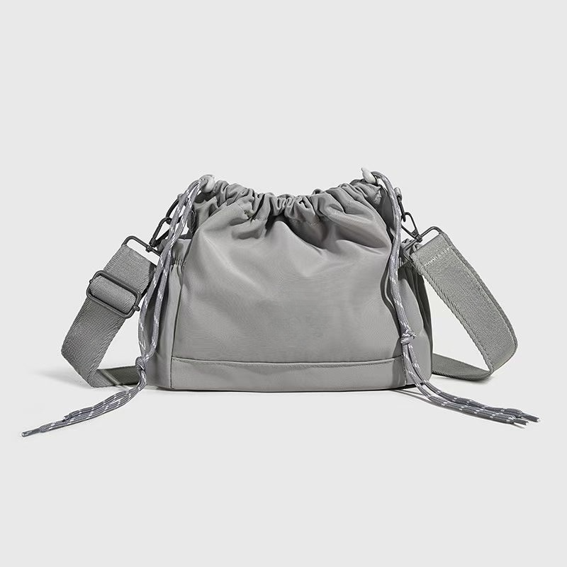 Women's new Joker drawstring wide shoulder strap crossbody bag