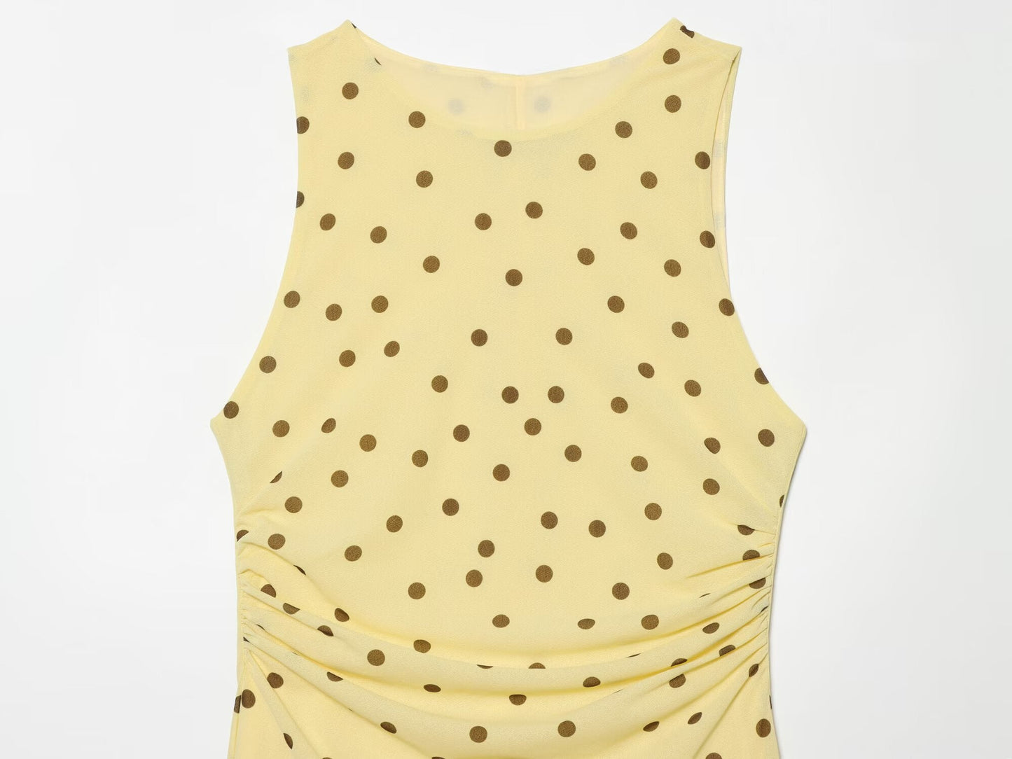 Women's sleeveless polka dot draped dress